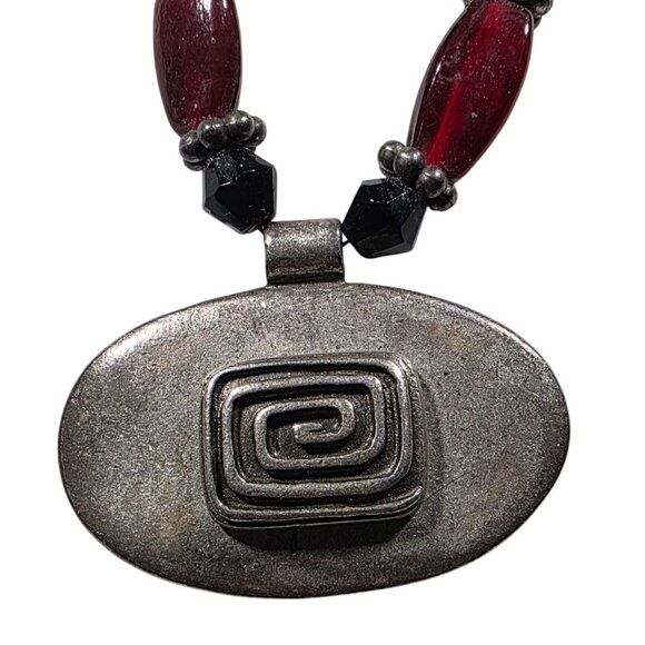 Chicos Red & Black Beaded Necklace With Oval Metal Pendant Swirl design - Picture 3 of 6